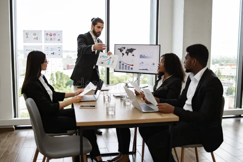 business team discussing financial report meeting room engaged discussion professional setting diverse coworkers 322689622 1